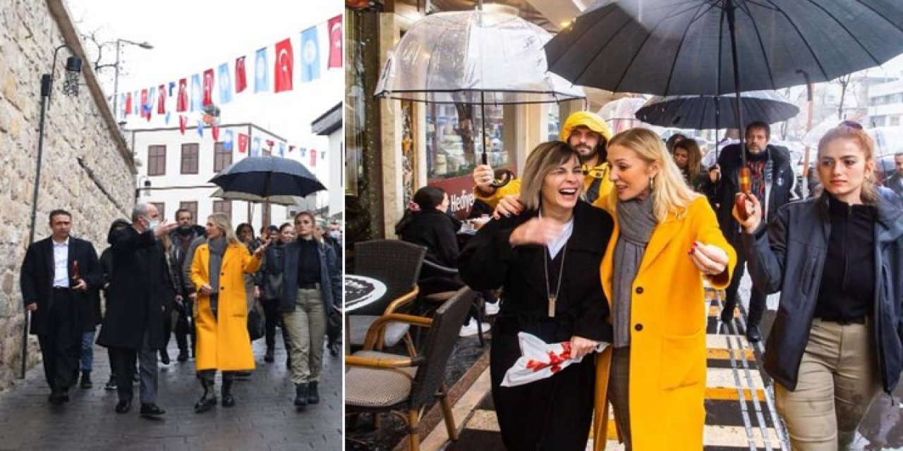 Bakan Ersoy'un eşi Pervin Ersoy, polise şemsiye tutturup çantasını taşıttı