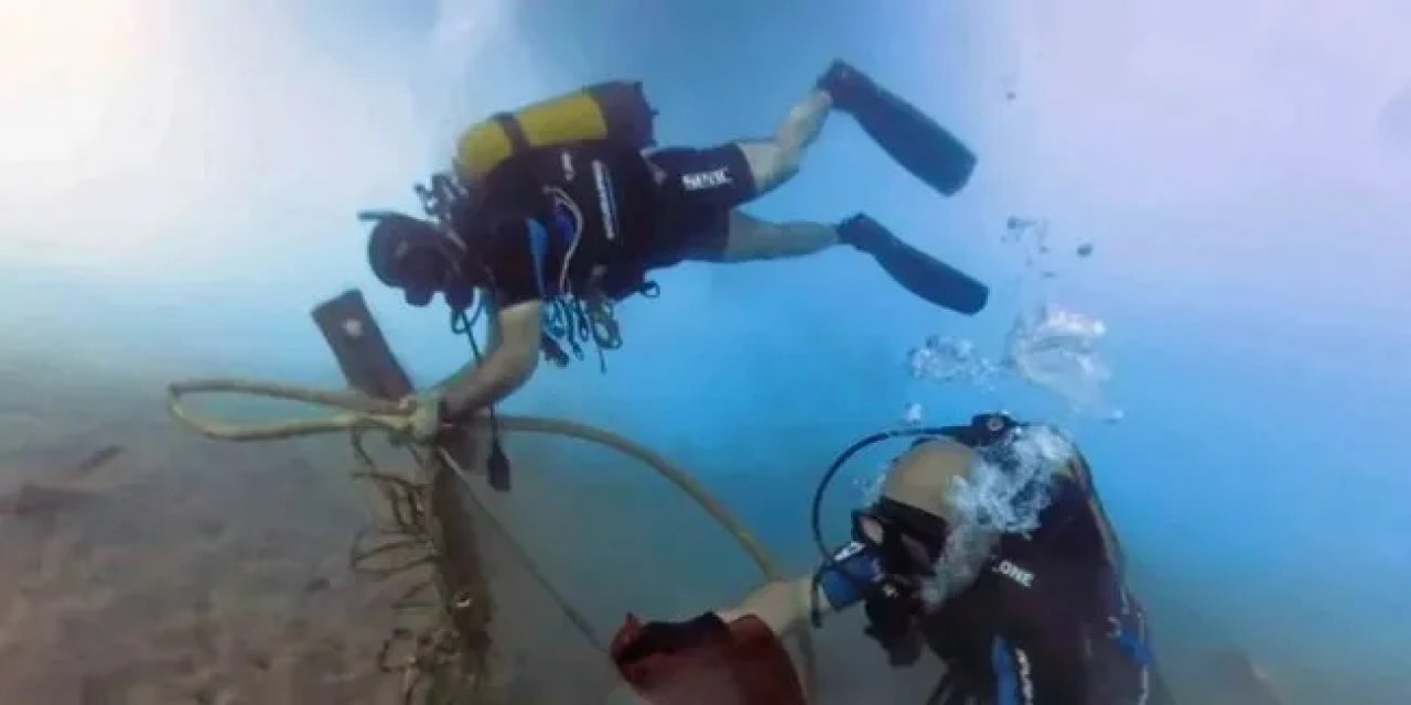 Fethiye'de Deniz Dibi Temizliği Yapıldı ve Denize 20 Bin Balık Yavrusu Bırakıldı